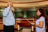 Chris Schalde is sworn in to his District C council seat Tuesday night following his selection by the Lemoore City Council. Hugh Allen, whom council members also selected, was not in the council chambers when he was picked.